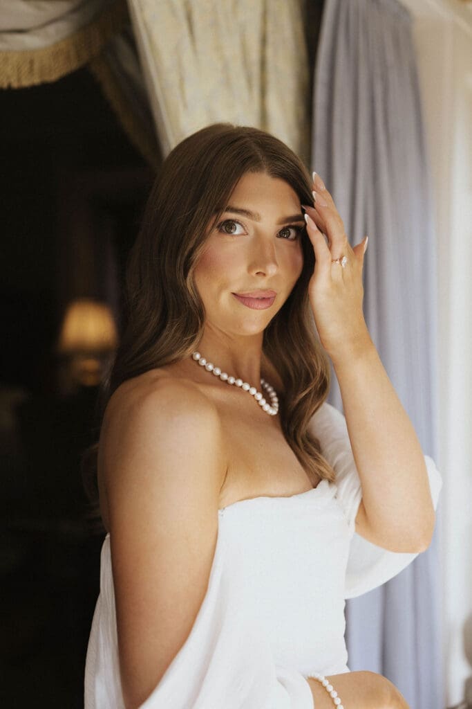 Timeless bridal portrait featuring a strapless wedding dress and pearl jewelry during a luxury estate wedding in Washington by Seattle wedding photographer Valen Lee Photography.